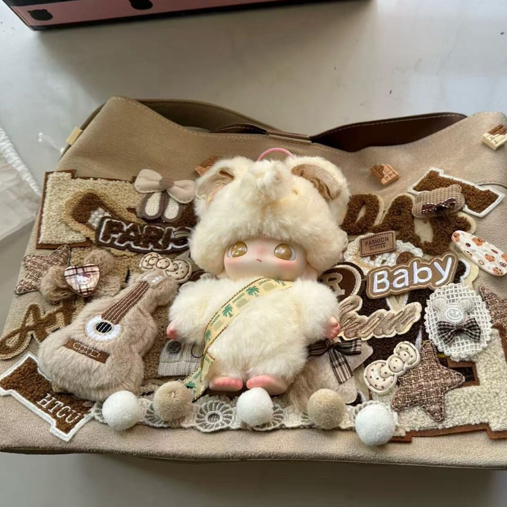 Adorable Beige Baby Bag with Plush Doll Accents
